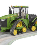 John Deere 9620RX Track Belts Tractor Toy Realistic 1 To 16 Scale German Made ABS Plastic Farm Vehicle on a road surface