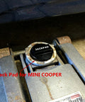 Black anodized jack pad adapter cap labeled JACKPAD installed in a car jack base