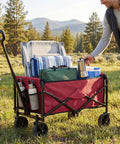 Collapsible Wagon Cart With 67L Storage And 220 Lb Weight Capacity Heavy Duty Folding Utility Wagon On Wheels For Beach Grocery Runs Camping And Garden Red carrying camping gear in a field.