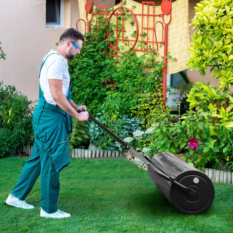 Person using Tow Behind And Manual Lawn Roller 30 Gallon Water Filled Steel Sod Roller with Push Pull Handle on grass