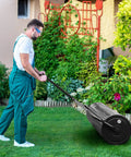Person using Push And Tow Lawn Roller With Ergonomic Handle And Scraper Bar For Easy No Fuss Soil Compaction In Lawns Yards Parks And Farms