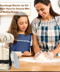 Woman and child in kitchen with Ultimate Sourdough Starter Kit For Home Bakers And Bread Nerds With 24 Oz Glass Jar and tools.
