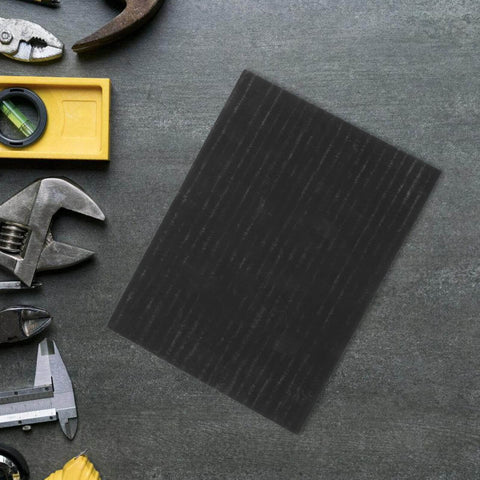 Heavy Duty High Purity Graphite Pad Plate 200 By 150 By 2.5 Mm next to tools on a workbench.