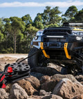 Heavy Duty 14.5 Ton Snatch Block For Winch Recovery With 32,000 Lbs Break Strength being used on an offroad vehicle