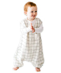 Toddler wearing Cozy Dreamsuit Toddler Sleep Sack With Feet For Safe Sleep And Easy Moves Walker Sleep Bag With Legs Bamboo Rayon.