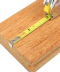 PowerLock Key Tape Measure 3 By 1 Quarter Inch Blade With Polymer Coated For Rust Resistance on a wooden surface