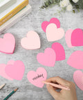 Pink Heart Index Cards Pack, 150 Count, 3x3 Inch cards on table with hand writing on pink heart, for study, office, and games.