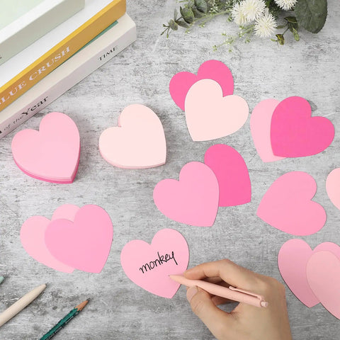 Pink Heart Index Cards Pack, 150 Count, 3x3 Inch cards on table with hand writing on pink heart, for study, office, and games.