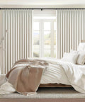 96 Inch Long Natural Pinch Pleated Blackout Curtains With Thermal Insulation And Linen Look One Panel 72W By 96L Inches Boss Level Light Blocking For Large Living Room Windows Track System Drapes For Bedroom Privacy And Noise Reduction in a bright bedroom setting.