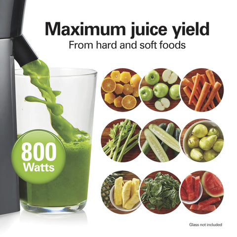 Front view of black juicer machine with 3in feed chute and 800W centrifugal extractor, pouring green juice into glass