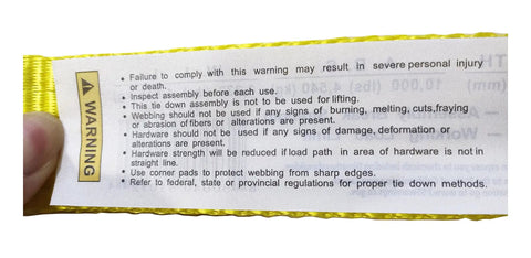 Warning label on yellow Heavy Duty 2 Inch By 27 Foot Ratchet Tie Down With Chain End And Grab Hooks 10000 Lbs Break Strength