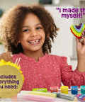 Girl holding a painted heart rock with glow paints from Glow In The Dark Heart Rock Painting Kit For Kids Ages 4 To 12