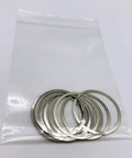 Heavy Duty 18-8 Stainless Steel Barrel Shim Nuts And Free Float Spacers With.001 To.004 Inch Thickness in a bag displaying 12 pieces.
