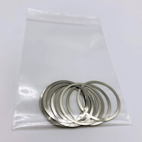 Heavy Duty 18-8 Stainless Steel Barrel Shim Nuts And Free Float Spacers With.001 To.004 Inch Thickness in a bag displaying 12 pieces.