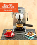 Compact Electric Bistro Style Espresso And Cappuccino Maker With Durable Glass Carafe on countertop with coffee.