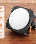Rechargeable Camping Lights Pack Of 2 With 2000mAh Each, USB-C portable LED tent lantern charging on wooden surface