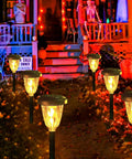 Lit Outdoor String Lights 50ft S14 LED Bulbs Extendable Up To 250ft Waterproof IP65 Shatterproof Vintage Edison Style illuminating a garden path