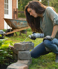 Woman applying Slick Landscape Foam Adhesive Quick Cure Gap Sealant on stone blocks in outdoor garden setting.