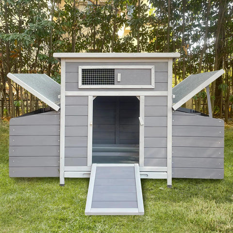 Front view of Sturdy Large Wooden Chicken Coop With Weatherproof Exterior And Six Nesting Boxes, removable tray, in backyard.
