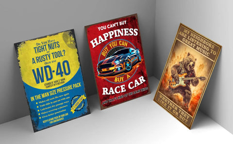 Three rusted tin metal wall plaques featuring humorous sayings for garage or man cave decor, showcasing vintage design.