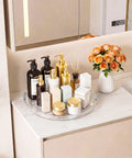 Smooth Operator 12 in Lazy Susan Turntable 4 Pack Crystal Clear BPA Free Plastic Pantry Cabinet Organizer for Spice Rack 360 Spin, showcasing skincare products on a round tray.