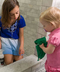 Children cleaning marble surface with Granite Cleaner And Polish For Marble Quartz Slate And Concrete Surfaces Streak Free Stone Countertop Cleaner And Stain Remover Pack Of 2 16oz Each Pomegranate Grapefruit Scent.
