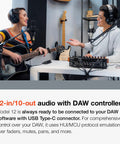 Two musicians using All In One 12-Track Digital Multitrack Studio Mixer With USB Audio Interface And DAW Control.