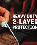 Close-up of a hand donning a black nitrile glove, illustrating heavy-duty two-layer protection.