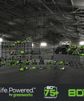 Greenworks 80V tools displayed in a warehouse, including All-Terrain Brushless Edger With 8 Inch Steel Blade And 2.25 Inch Pro Depth