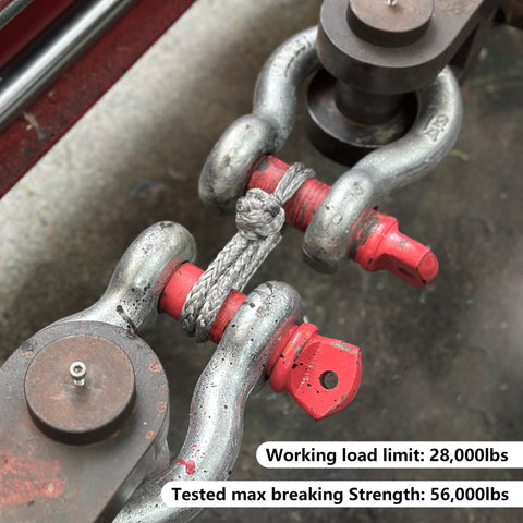 Close-up of Red Recovery Ring And 2 Red Soft Shackles Kit for Synthetic Winch Rope in heavy-duty off-road recovery setup