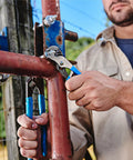 Person using Tongue And Groove Pliers 426 Straight Jaw 0.87 Inch Jaw Heat Treated Teeth 6.5 Inch Length Made In USA.