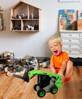 Child playing with Three In One Skid Steer Loader Construction Toys Set One Fifty Scale Diecast Site Loader in a room with toys.