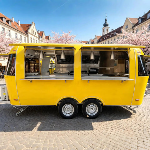 Top Tier Stainless Steel Food Trailer A Solid 16 Foot Yellow Mobile Kitchen Built Tough And Dot Certified For Street Ready Operators Running A Smooth Hustle With Zero Headache Logistics, showing exterior view with open serving windows.