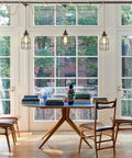 Three Light Plug In Pendant Fixture Built Different Hemp Rope Wire Hanging Lamp Fly Setup For Kitchen Island Living Room Decor Lowkey Modern Vibe Safe UL Certified Sockets Long Reach Cord over a dining table.