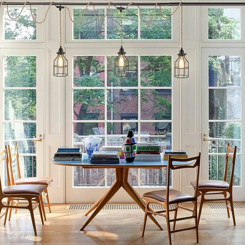 Three Light Plug In Pendant Fixture Built Different Hemp Rope Wire Hanging Lamp Fly Setup For Kitchen Island Living Room Decor Lowkey Modern Vibe Safe UL Certified Sockets Long Reach Cord over a dining table.