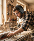 High Quality Hearing Protection Ear Muffs SNR 29 dB being used by a man woodworking, adjustable headband visible