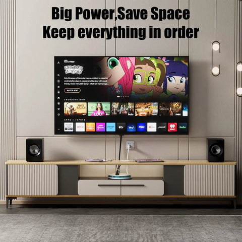 Living room setup with All In One Dope Surge Protector Power Strip, TV, and speakers on a modern entertainment console.