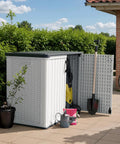 Outdoor Storage Cabinet 26 Cu Ft With Lockable Doors, Waterproof Patio Shed beside brick wall with gardening tools
