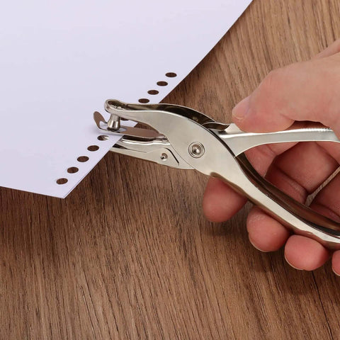 Using One Eighth Inch Single Hole Punch Tool Twenty Four Pack Handheld Metal Paper Puncher for creating holes in paper for crafts.