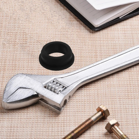 Sturdy Black Silicone Grommet Kit For Cables And Wires Heat Resistant Flexible Desks Protect Wall Holes Aesthetic Industrial Use Efficient black silicone grommet beside wrench