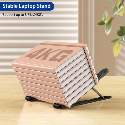 Ergonomic Laptop Stand For 10 To 14 Inch Laptops Portable Riser With 8 Adjustable Angles loaded with books showing durability