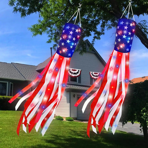 Pair Of 60 Inch American Flag Windsocks With Red White Blue LED Lights For Outdoors Patriotic Fourth Of July Memorial Day Decor 250th Anniversary USA Windsocks Festive Outdoor Display hanging in front of a house.