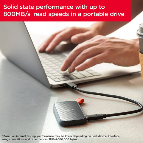 1TB Portable SSD With Up To 800 MB Per Second Read Speeds, USB C And USB 3.2 Gen 2 connected to a laptop for fast storage