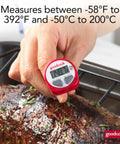 Hand using Must Have Everyday Digital Food Thermometer With Stainless Steel Probe Instant Read For Quick Accurate Temps In Fahrenheit Or Celsius, Easy To Read LCD Display, Includes Storage Sleeve, Red, on cooked meat.