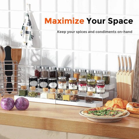 Three Tier Expandable Spice Rack Organizer For Cabinet And Countertop Fully Adjustable Width Design Dead Simple Pantry Layout White Matte Finish with jars and seasonings on countertop.