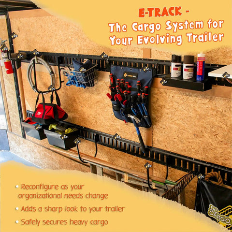 E Track system in trailer with tools and accessories mounted on wall rails for organizing and securing cargo.