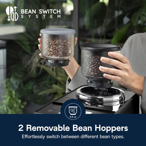 Person switching hoppers on Rivelia Automatic Espresso Machine With Built In Burr Grinder And Milk Frother One Touch Barista Quality Hot And Iced Lattes Cappuccinos Bean Switch System Compact Italian Design Black