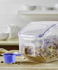 Heavy Duty Bulk Food Storage Containers With Smooth Rolling Wheels And Snap Tight Lids, 50 Cup Dry Goods Pantry Bin With Measuring Cup filled with granola.