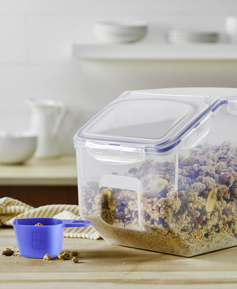 Heavy Duty Bulk Food Storage Containers With Smooth Rolling Wheels And Snap Tight Lids, 50 Cup Dry Goods Pantry Bin With Measuring Cup filled with granola.