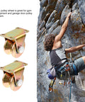 Heavy Duty Steel Pulley Block For Sliding Gates With Track Wheel, shown uninstalled with rock climbing in the background